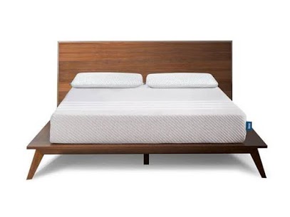 Modern wooden platform bed with white mattress